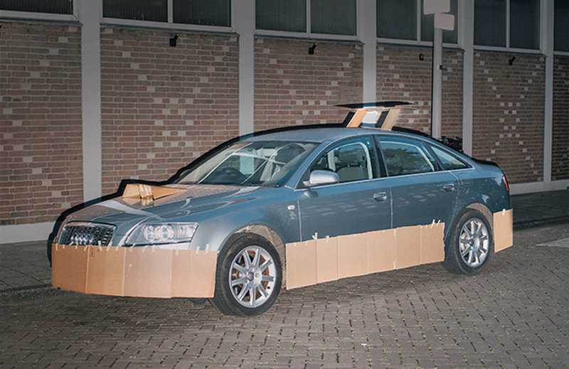 Illustration for article titled This Artist Turns Boring Rides Into Supercars At Night Using Cardboard